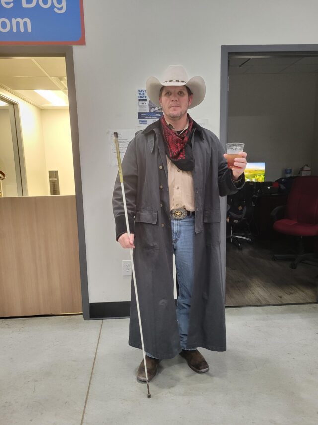 Photo of Brandon in western wear.