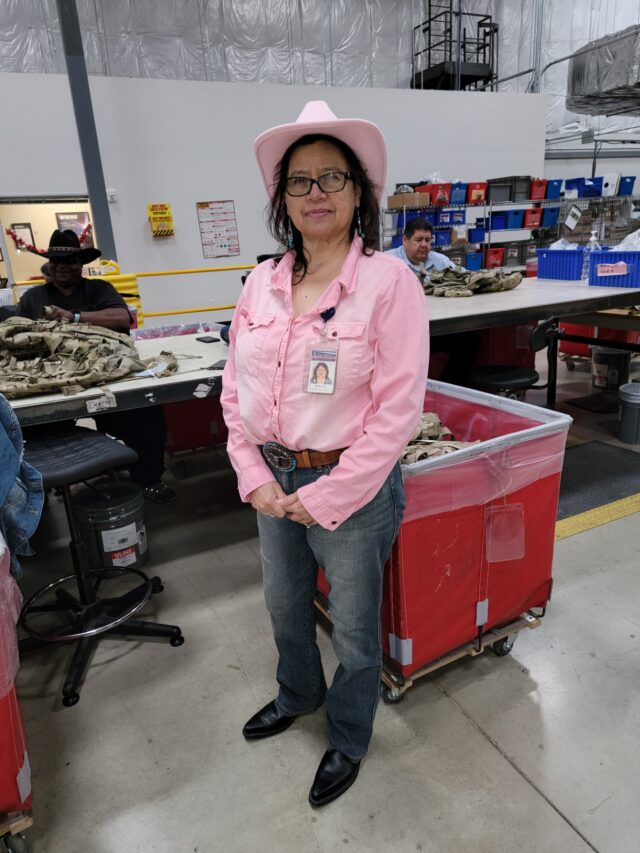 Photo of Emma in pink western wear.